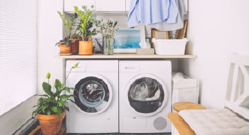 a white washer and dryer in a laundry room