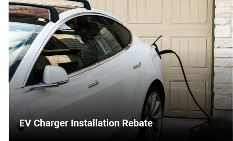 a white electric vehicle plugged into a residential ev charger